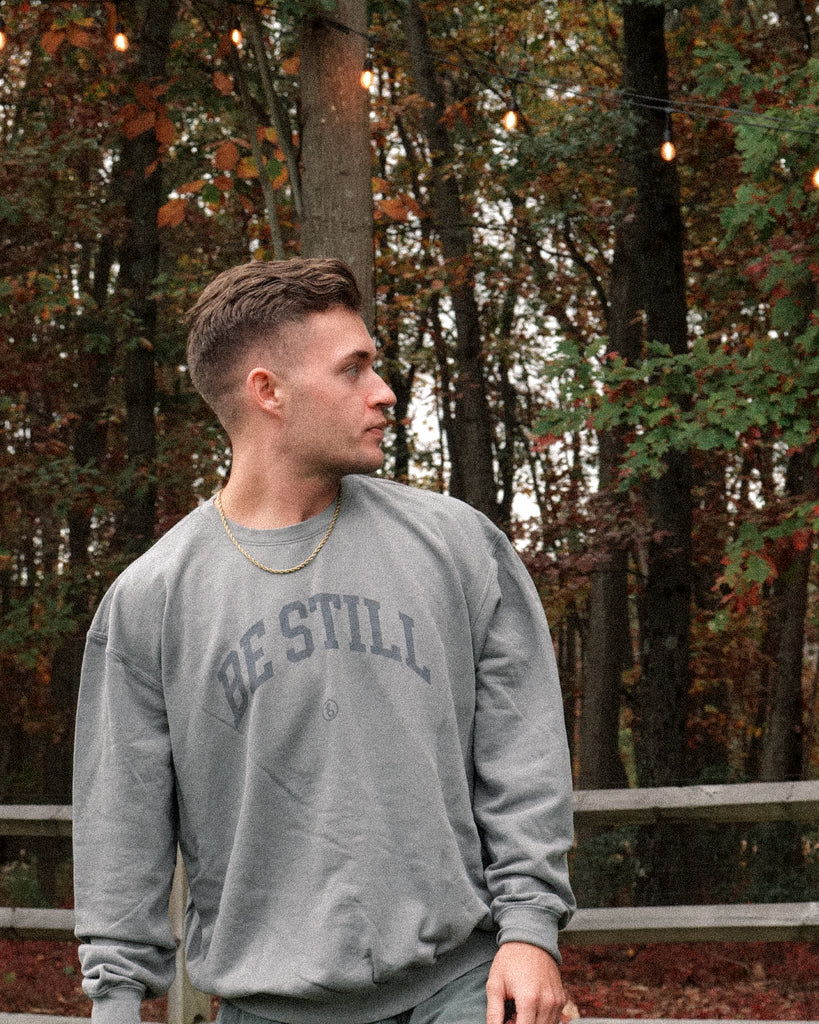BE STILL University Style Crewneck Sweatshirt